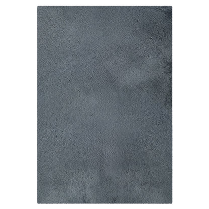 Azaliya Dark Grey Faux Rabbit Fur Rug 120x180cm features a soft, short-pile texture. Laid flat, this rectangular rug showcases plush, luxurious faux fur suitable for modern and minimalist interiors.