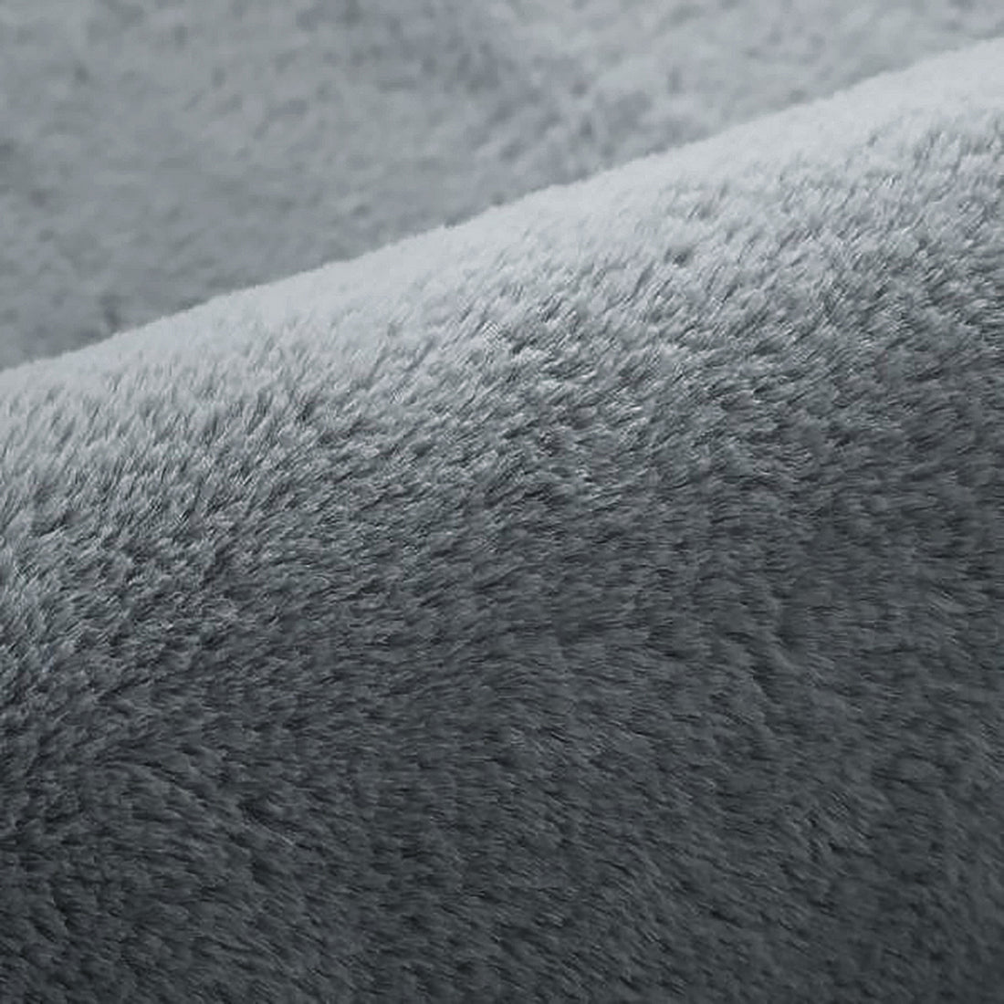 Close-up of the Azaliya Dark Grey Faux Rabbit Fur Rug, showcasing its plush, soft texture and medium-pile height, designed for a modern look and cosy feel.