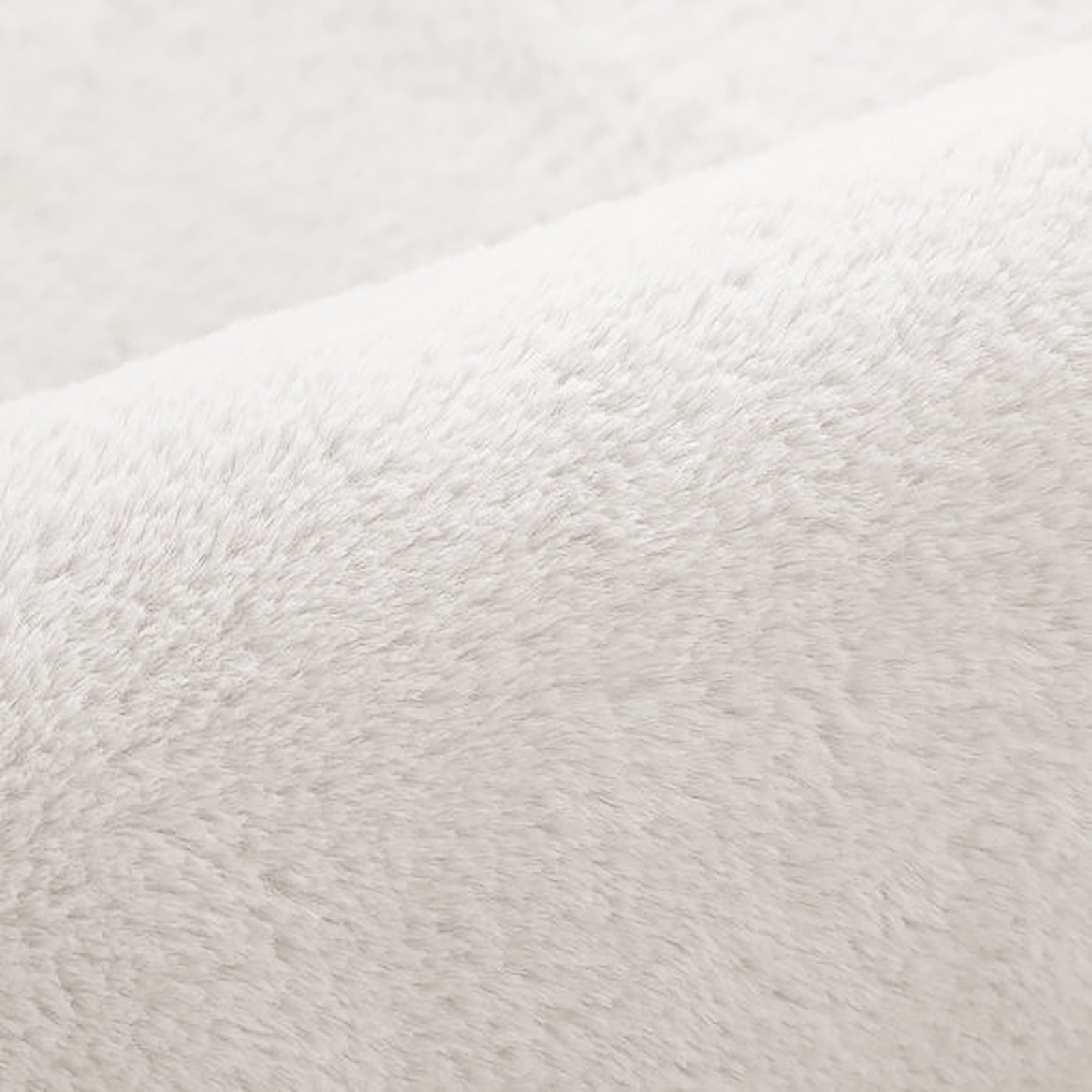 Close-up of the Azaliya Cream White Faux Rabbit Fur Rug 120x180cm, showcasing its plush, soft fibers resembling sherpa fleece or microfiber, highlighting the luxurious and cozy texture.
