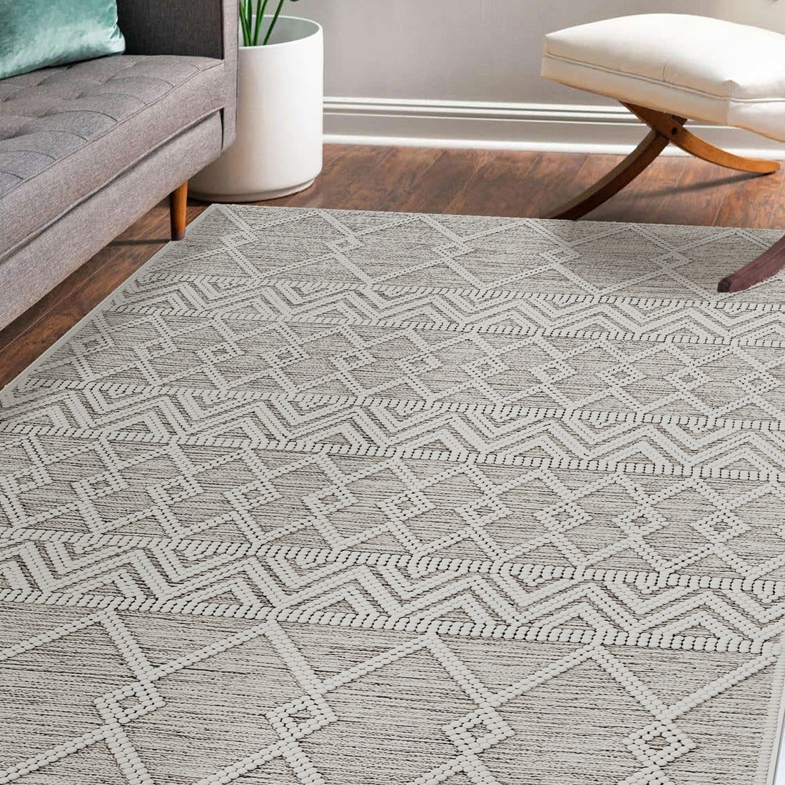 Benita 160x230cm Medium Soft Modern Printed Indoor Floor Rug with light-beige hue and raised white geometric patterns, placed in a cozy living room setting with hardwood flooring and mid-century furniture.