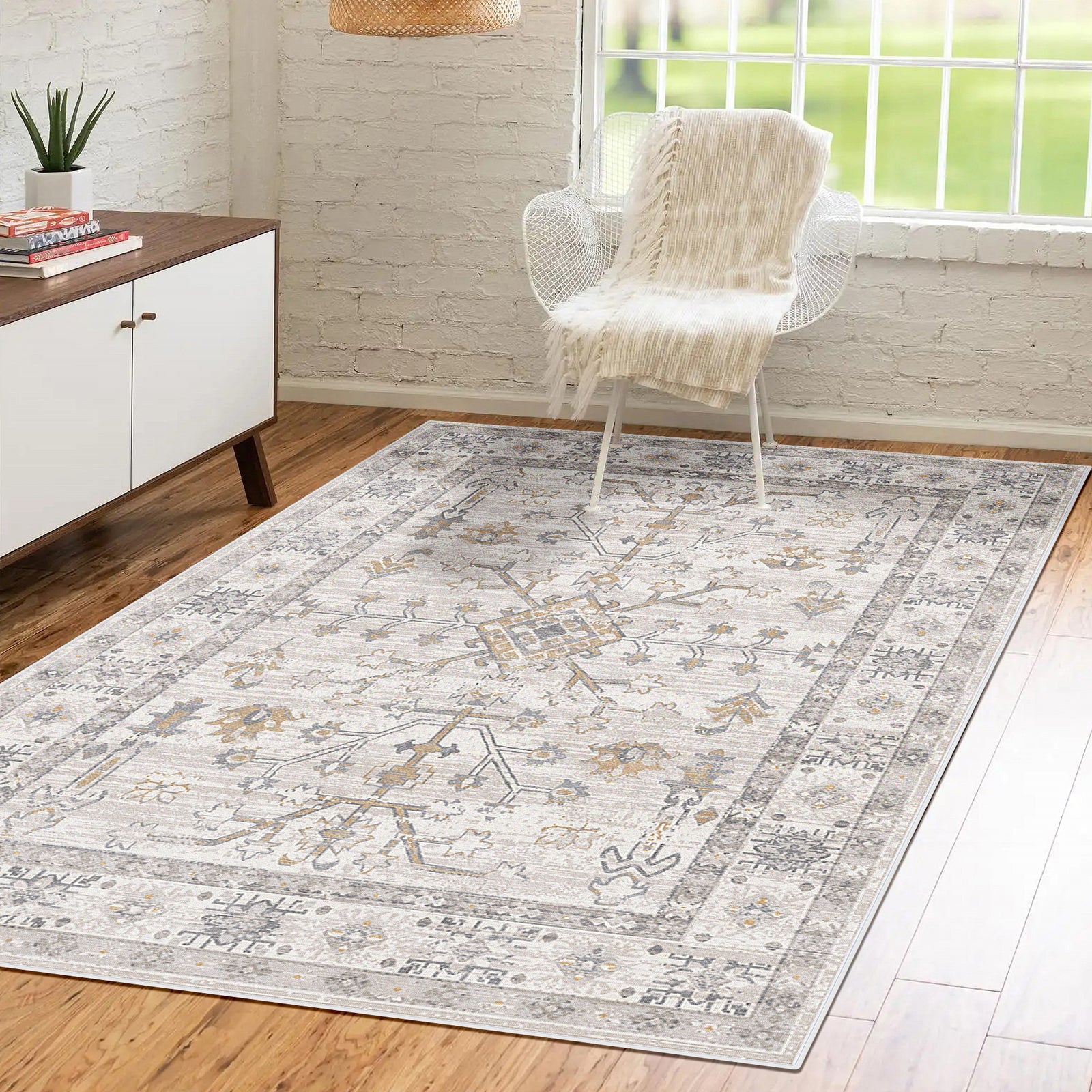 Bortan 200x300cm Large Persian Indoor Floor Rug with a vintage pattern on a wood floor, complemented by a white accent chair, cream throw, and mid-century modern sideboard in a sunlit room.