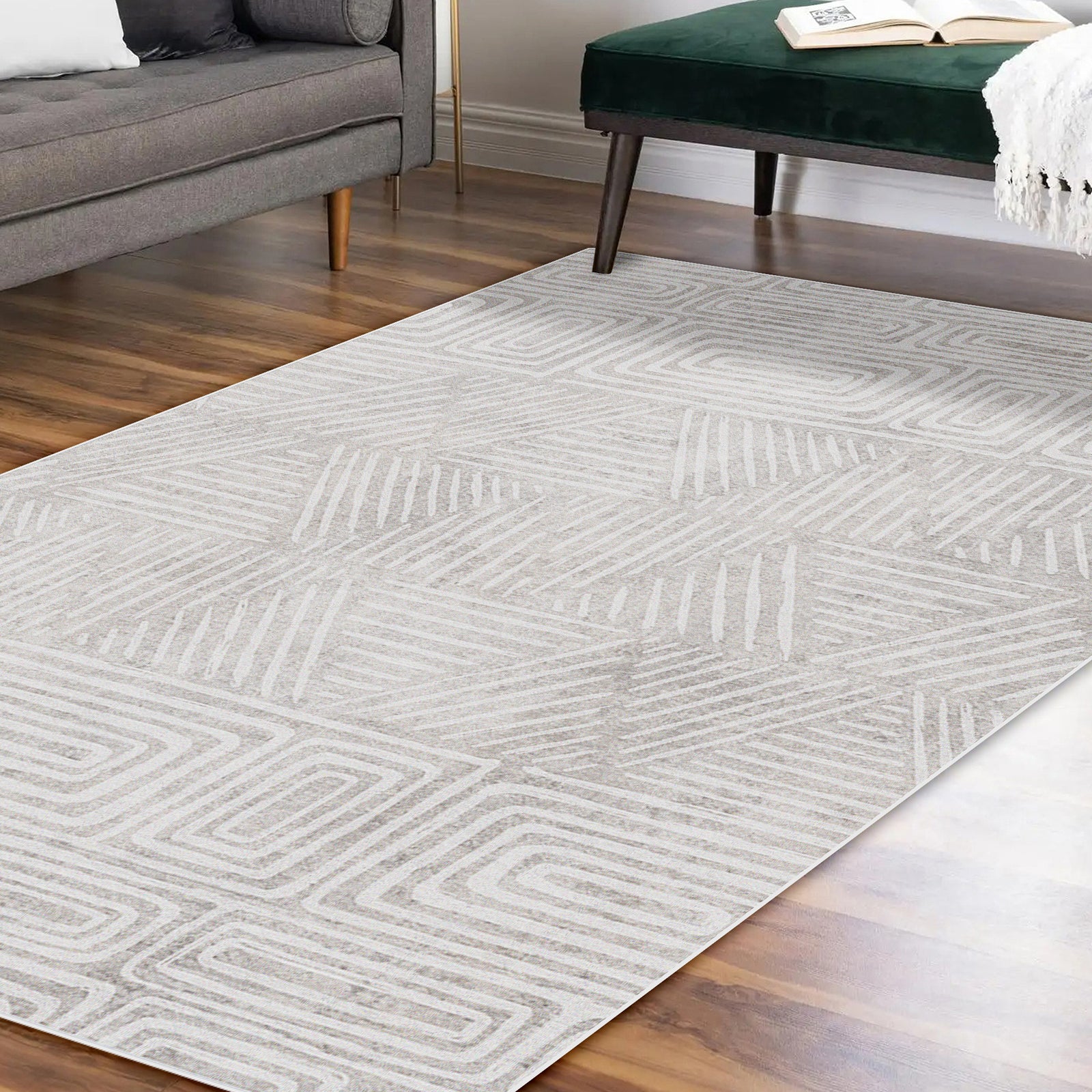 Duved 120x180cm Small Contemporary Indoor Floor Rug with geometric pattern, showcased on hardwood flooring, accompanied by a mid-century gray sofa and dark green velvet bench, highlighting modern decor.