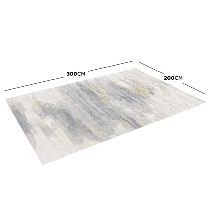 Getbo 200x300cm Large Modern Indoor Floor Rug featuring an abstract pattern in muted greys, blues, and gold. Showcased at an angle on a white background, highlighting its dimensions and painterly design.