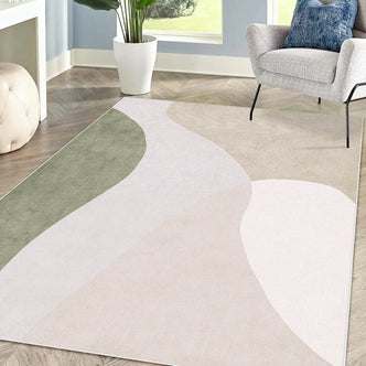 Gonas 120x180cm Small Abstract Indoor Floor Rug with flowing, muted earth-tone shapes on wood floors, complementing a gray armchair, white pouf, and tall potted plant in a serene nook.
