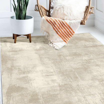 Huken Contemporary Art Rug 160x230cm, a softly textured beige floor covering, complements the minimalist room with a mid-century planter and rattan swing chair, enhancing the modern, airy ambiance.