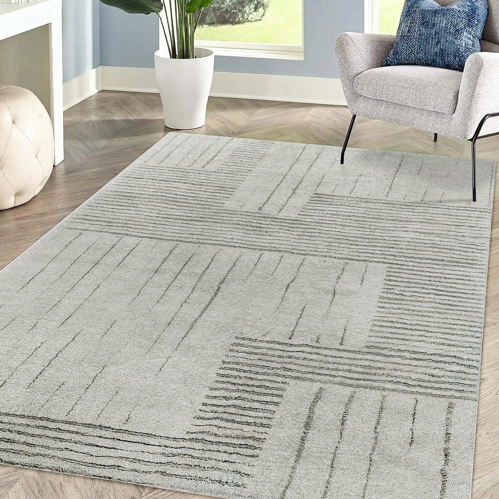 Jabeza Soft Contemporary Printed Rug 120x180cm displayed on a wooden floor, emphasizing its soft 12mm pile and modern design, ideal for adding warmth and comfort to home interiors.