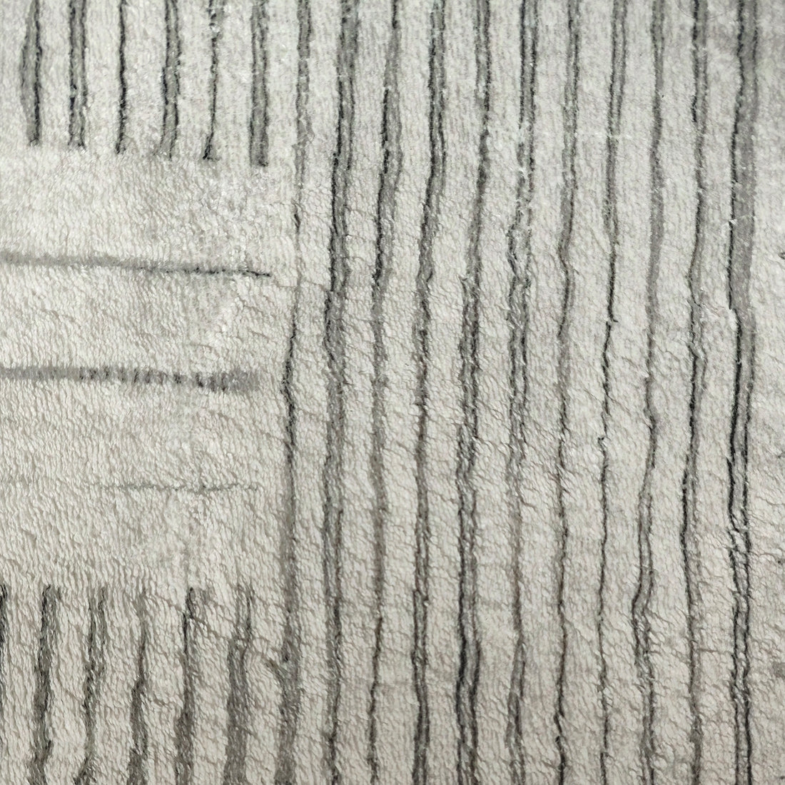 Jabeza Soft Contemporary Printed Rug 200x300cm, showcasing a close-up of its abstract, monochrome pattern, highlighting the soft 12mm pile and durable texture designed for modern home interiors.
