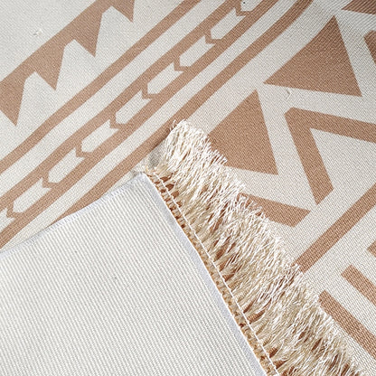 Close-up of Kaley 200x300cm Woven Cotton Blend Tasseled Indoor Rug featuring a beige-and-white geometric pattern with zig-zags and triangles, tasseled edges, and a tightly woven backing.