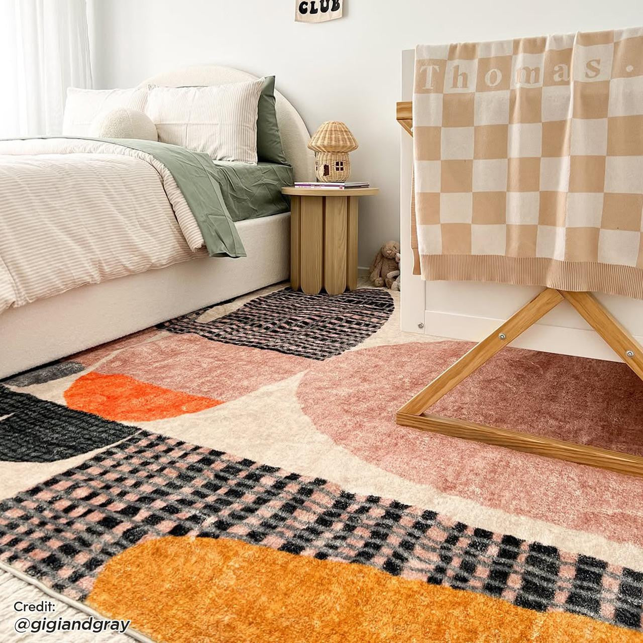 Close-up of the Kangos Contemporary Art Rug 200x300cm, showcasing its modern design with contrasting printed patterns, providing texture and style, perfect for enhancing interior spaces.