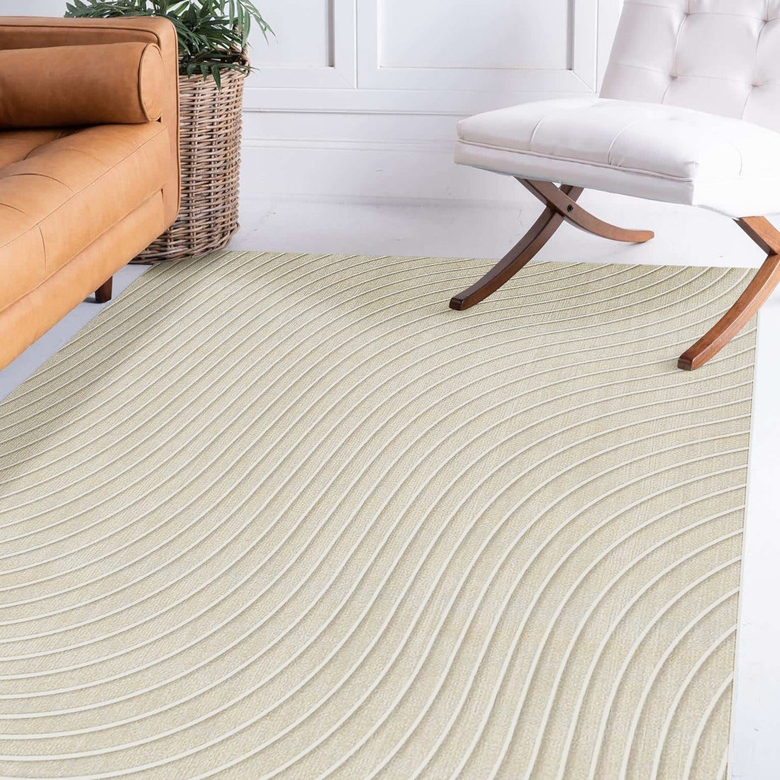 Meraker 200x300cm Modern Abstract Floor Rug displayed under a tan-brown leather sofa and a white upholstered chair, featuring flowing wave patterns and enhancing the room's minimal, modern aesthetic.