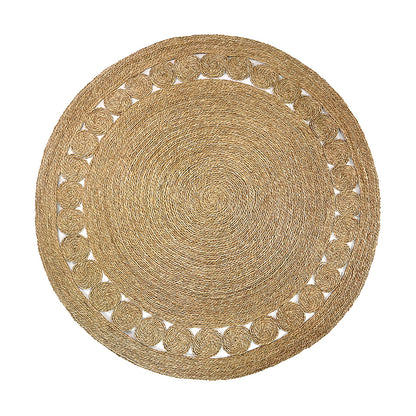 Ophelia 180cm Round Textured Seagrass Indoor Rug in Natural, featuring woven concentric spirals with a decorative outer edge of smaller spiral coils, perfect for rustic or bohemian décor.