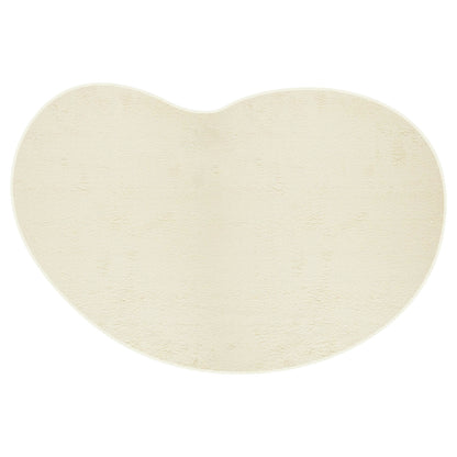 Parna 240 x 330cm Curved Shaggy Rug in Beige, featuring a plush high pile and unique U-shape design, ideal for adding cosy elegance and stability with its non-slip backing in spacious interiors.