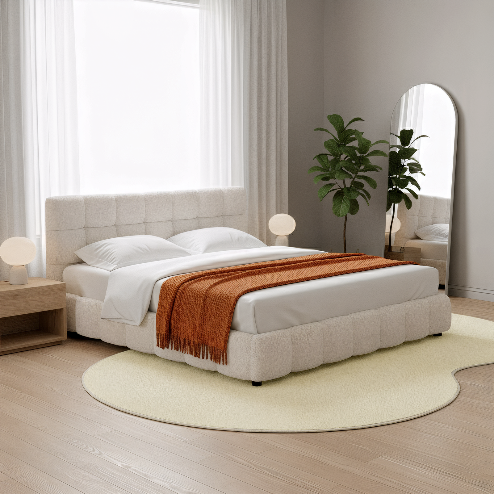 Parna 200x300cm Curved Large Soft Rug in Beige lies under the bed, showcasing its organic shape and plush texture, subtly enhancing the minimalist bedroom with its modern, elegant design.