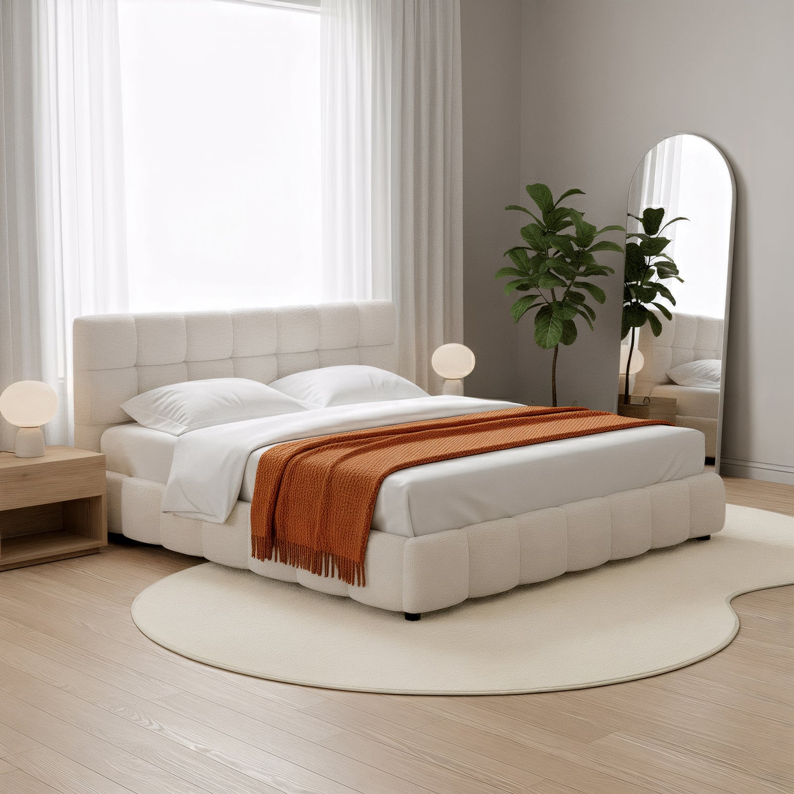 Parna 200 x 300cm Curved Soft Rug in Cream White lies beneath the bed, showcasing its plush, sculptural design amidst a cozy bedroom setting with a modern, minimalist aesthetic.