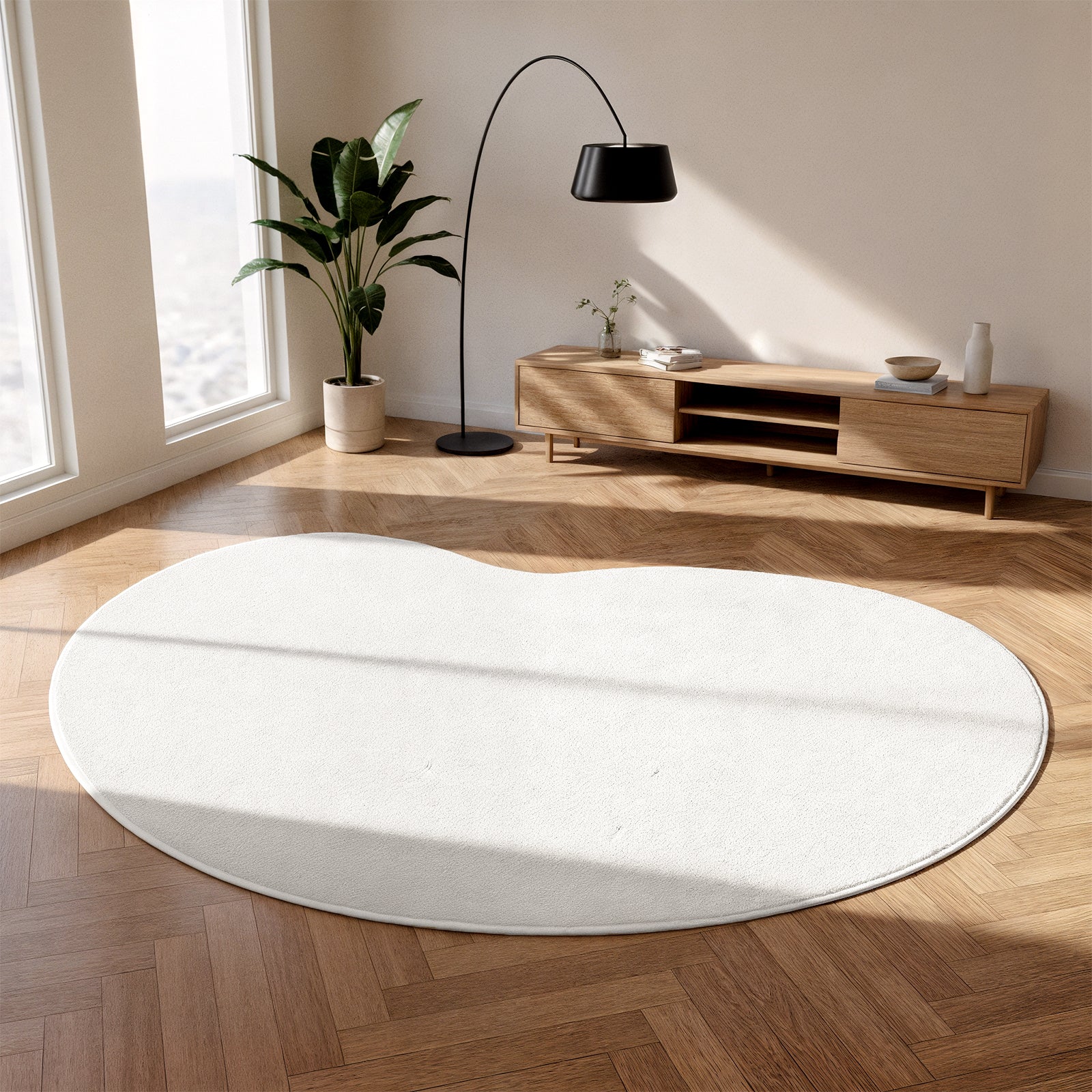 Parna Curved 300x400cm Large Soft Rug in Cream White elegantly centers the sunlit room, its unique curved design enhancing the minimalist space with plush comfort, surrounded by a media console and natural light.
