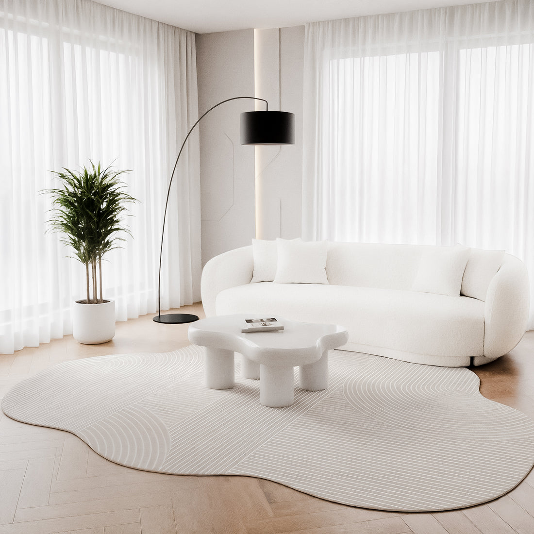 Penina 200 x 300cm Cloud Soft Rug in Neutral beneath a white coffee table, featuring an irregular shape and subtle linear patterns, harmoniously blending with a plush, curved white sofa in a minimalist living room.
