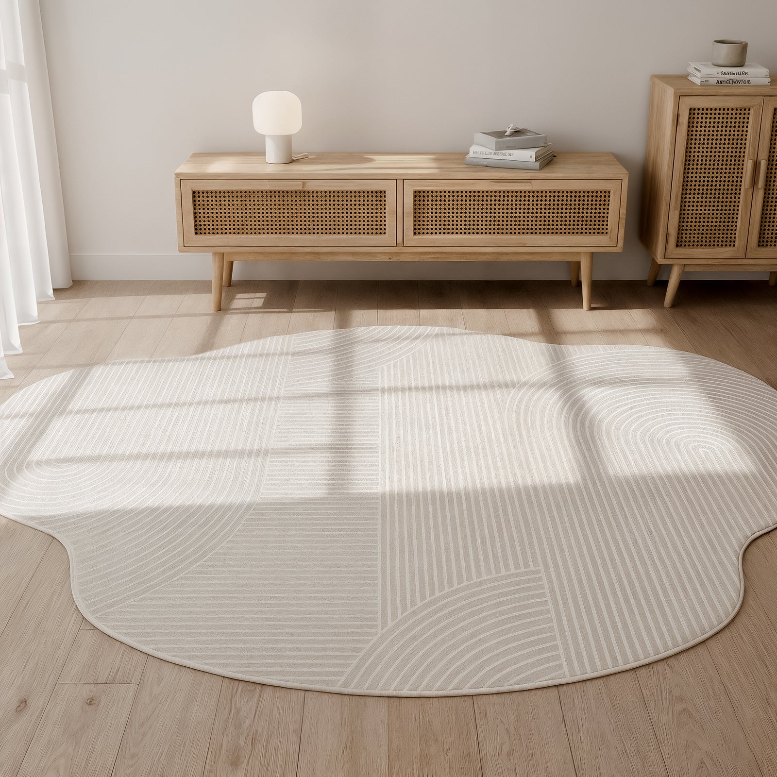 The Penina 300 x 400cm Cloud Soft Rug in Neutral, with its pale cream hue and subtle concentric stripes, complements the mid-century console and airy, light-filled space beautifully.