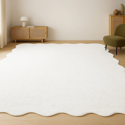 Pixie 200x300cm Large Wavy Shag Rug in Cream White, featuring an irregular scalloped design, covers the light wood floor, enhancing the minimalist living area's modern aesthetic with its plush, textured appearance.