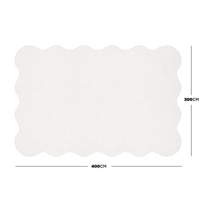 Pixie 300x400cm Large Wavy Shag Rug in Cream White, featuring gently scalloped edges and an anti-slip backing, offering plush comfort with its 12mm pile height for spacious rooms.