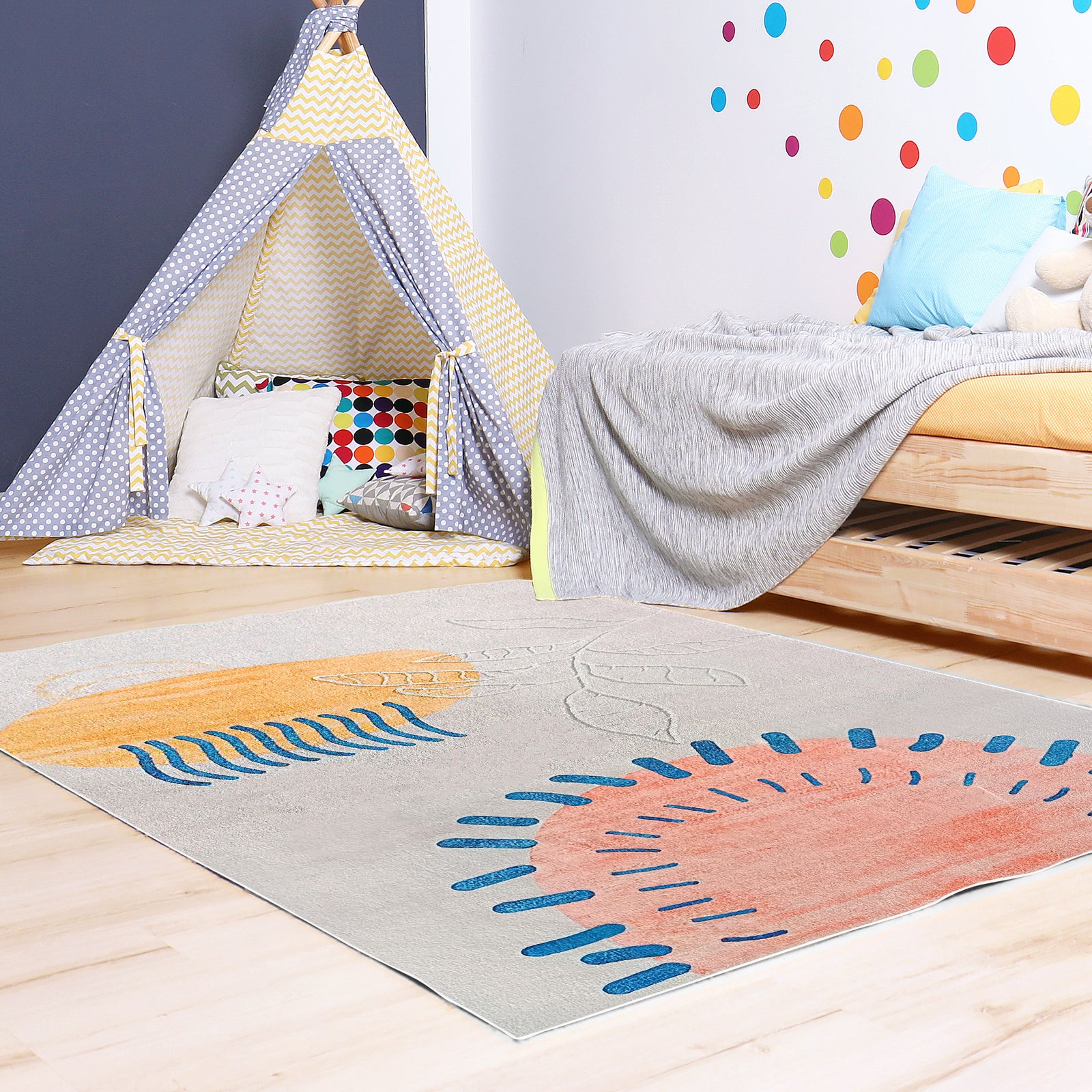 Rokke 160x230cm Kids Modern Abstract Indoor Floor Rug with sunburst patterns in orange, salmon, and blue lies on a pale wood floor in a colorful children's room, enhancing warmth and character.