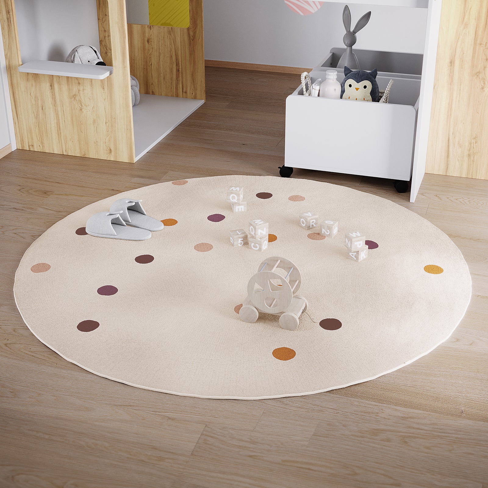 Roya 160x160cm Round Polka Dot Kids Indoor Rug on light oak floor, featuring cream with rust, mauve, tan, and brown polka dots, surrounded by gray slippers, toy blocks, and a wooden pull-along toy.