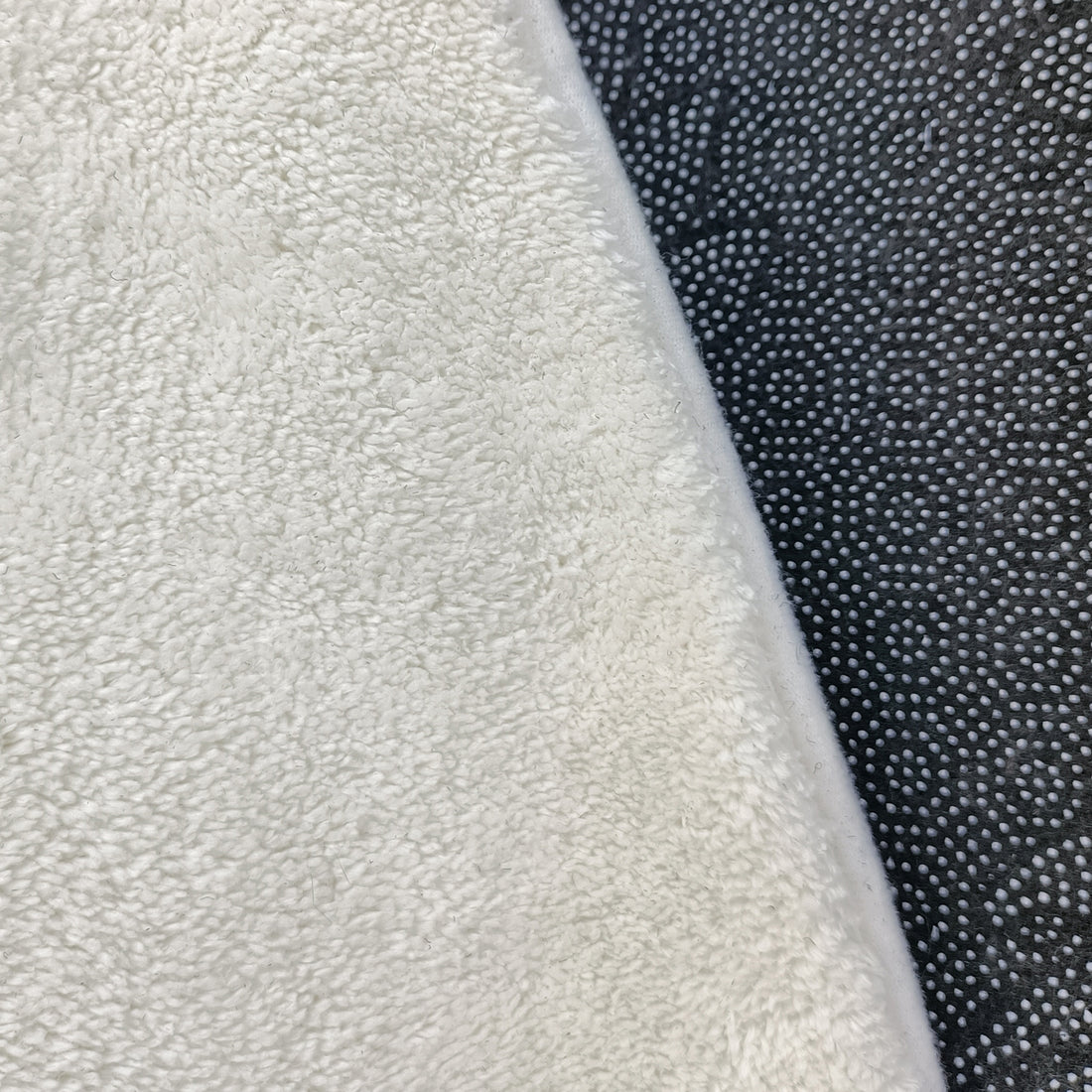 Close-up of the Roya 160x160cm Round Polka Dot Kids Indoor Rug, featuring plush terry-cloth on the left and an anti-slip, raised-dot textured silicone mat on the right.