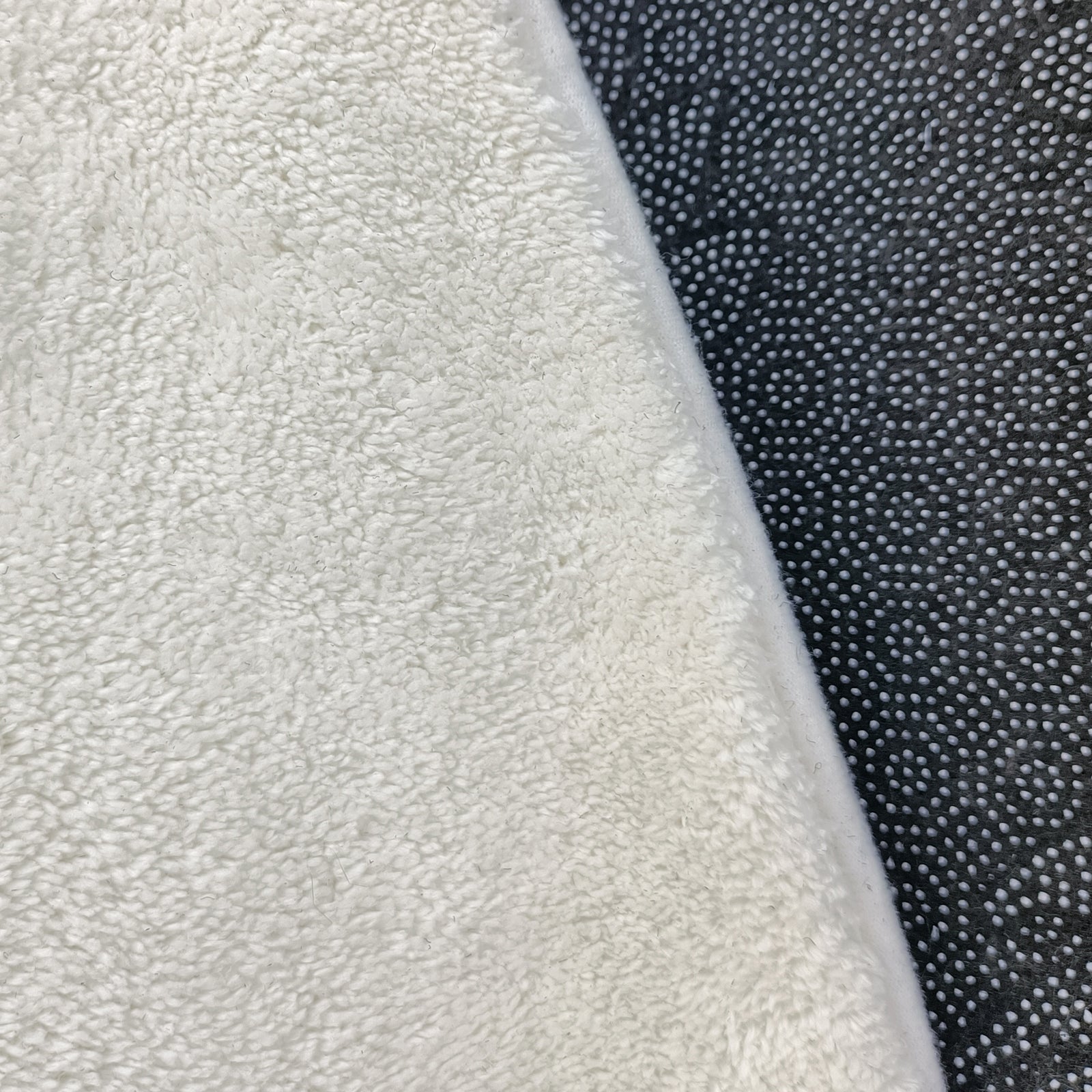 Close-up of the Roya 160x160cm Round Polka Dot Kids Indoor Rug, featuring plush terry-cloth on the left and an anti-slip, raised-dot textured silicone mat on the right.