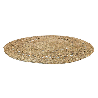 Sandra Brown Seagrass Rug 180cm features a large, round woven design with concentric braided natural fibers, ideal for adding warmth and texture to minimalist or modern interiors.