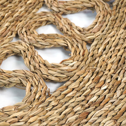 Close-up of the Sandra Brown Seagrass Rug 180cm, showcasing intricately woven natural fibers, highlighting its handmade texture and circular design, perfect for adding warmth to minimalist or modern interiors.