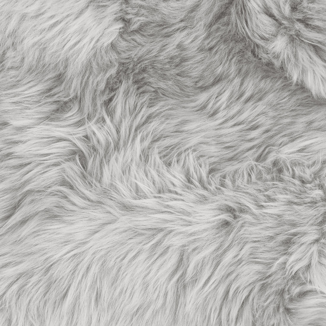 Close-up of the Silvanus 60x90cm Shaggy Soft Fluffy Fur Rug in Grey, showcasing its plush, shaggy faux-fur texture with wispy fibers, ideal for a cosy and stylish decor touch.