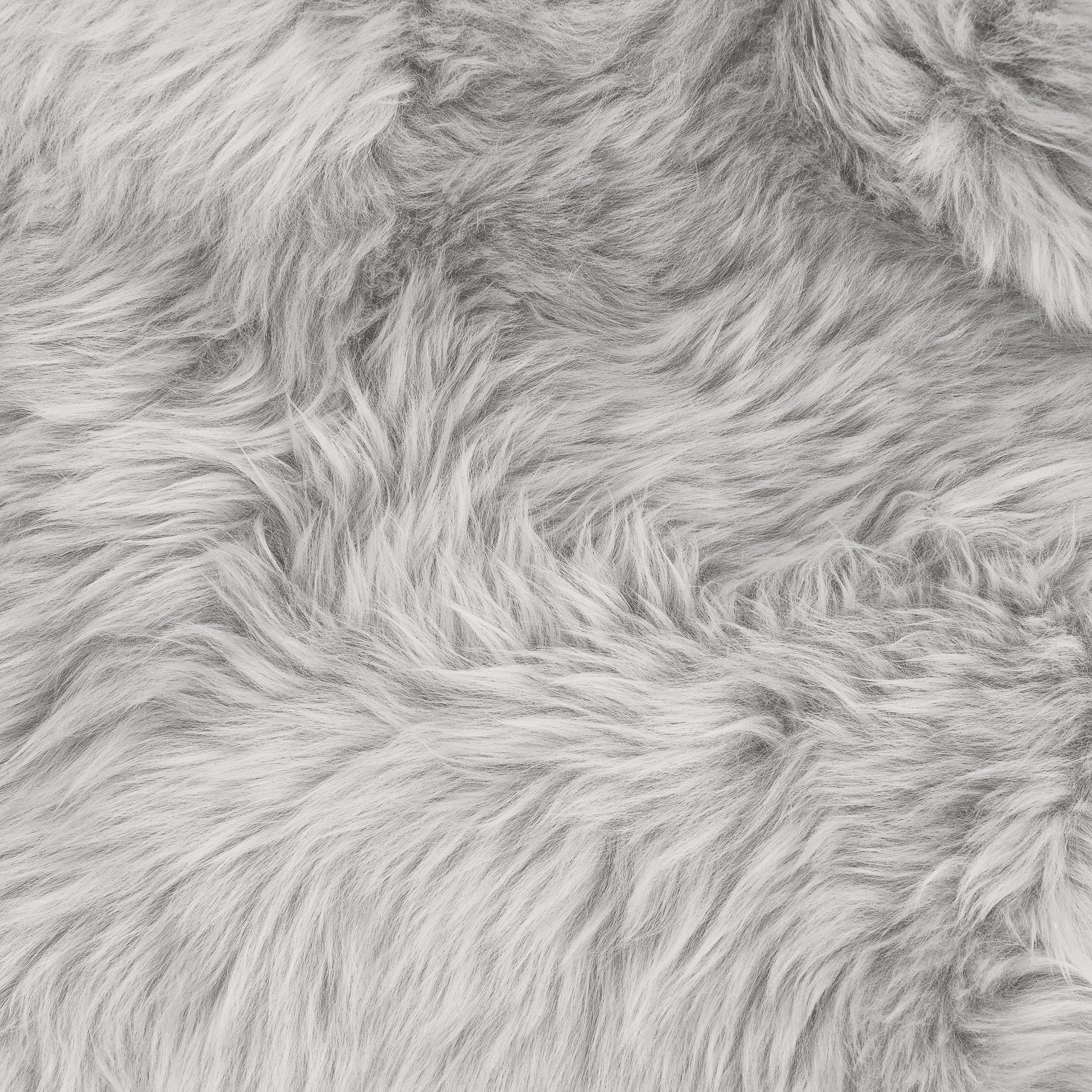 Close-up of the Silvanus 60x90cm Shaggy Soft Fluffy Fur Rug in Grey, showcasing its plush, shaggy faux-fur texture with wispy fibers, ideal for a cosy and stylish decor touch.