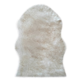 Silvanus 60x90cm Shaggy Soft Fluffy Fur Rug in Tan & White, showcasing an irregular, plush texture with an organic outline, mimicking genuine sheepskin, perfect for adding cosy elegance to any space.