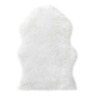 Silvanus 60x90cm Shaggy Soft Fluffy Fur Rug in White, featuring a plush, faux-sheepskin texture on a plain background, offering a cosy and luxurious look for any room.
