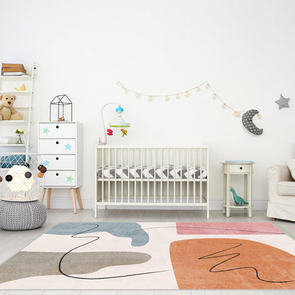 Skalo 160x230cm Medium Contemporary Colourful Kids Indoor Rug with abstract design, featuring muted shades and black squiggles, lies beneath a modern nursery setup with crib and decor elements.