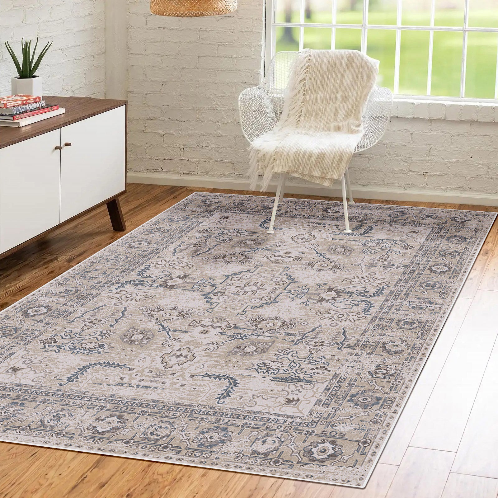 Trolvik 160x230cm Medium Persian Indoor Floor Rug with antique-inspired medallion pattern lies on hardwood floor. Its subtle beiges, greys, and blues complement the minimalist room setting.