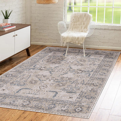 Trolvik 160x230cm Medium Persian Indoor Floor Rug with antique-inspired medallion pattern lies on hardwood floor. Its subtle beiges, greys, and blues complement the minimalist room setting.