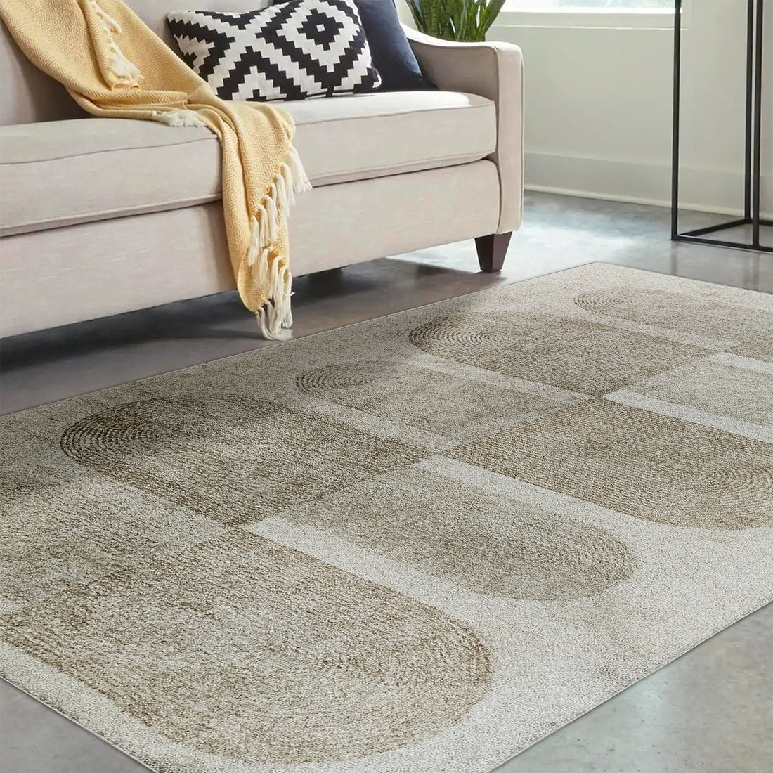 Tyche Soft Contemporary Printed Floor Rug 160 x 230cm showcased on a floor, highlighting its plush texture and intricate pattern. The surrounding furniture includes a couch with a black and white pillow and yellow blanket.