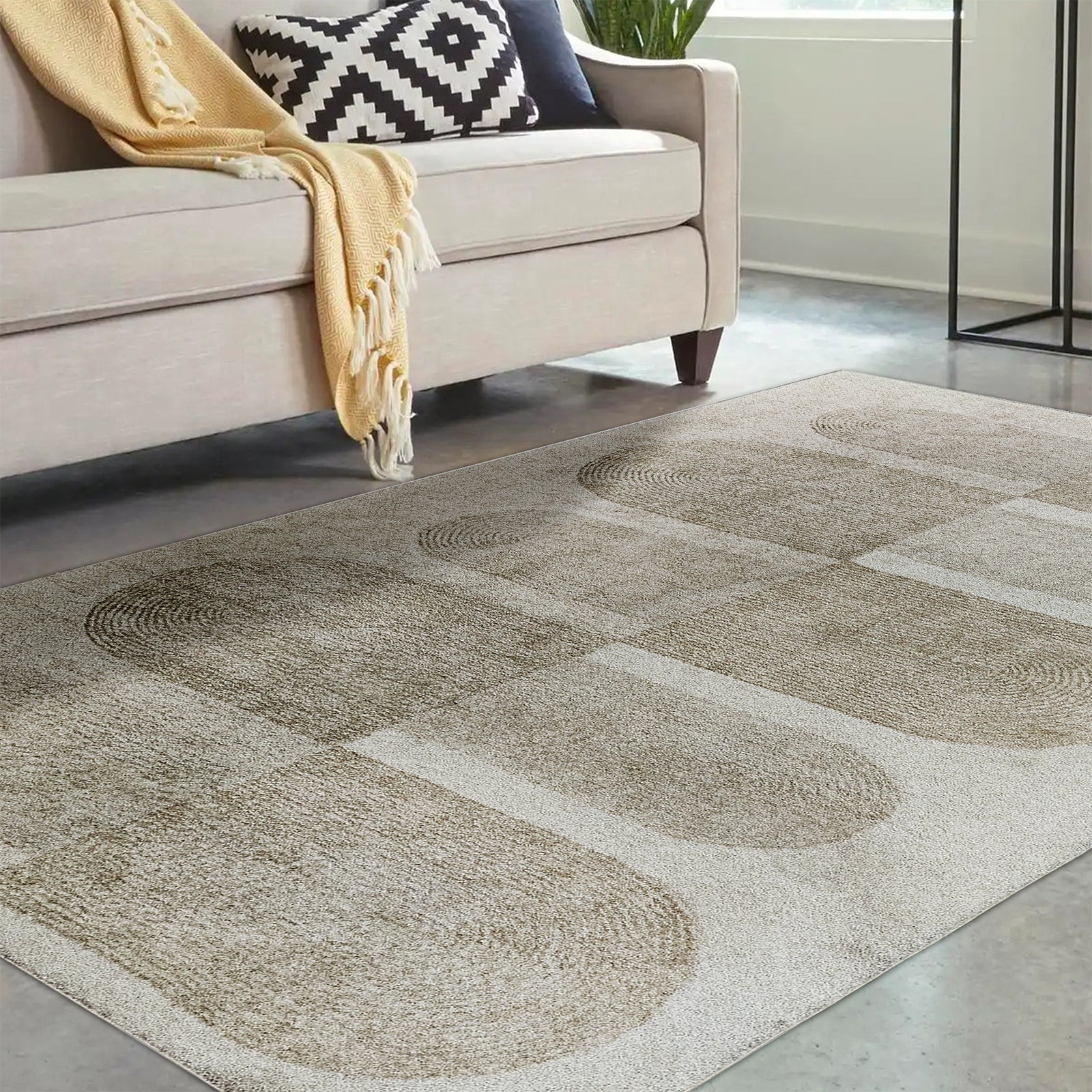 Tyche Soft Contemporary Printed Floor Rug 160 x 230cm showcased on a floor, highlighting its plush texture and intricate pattern. The surrounding furniture includes a couch with a black and white pillow and yellow blanket.
