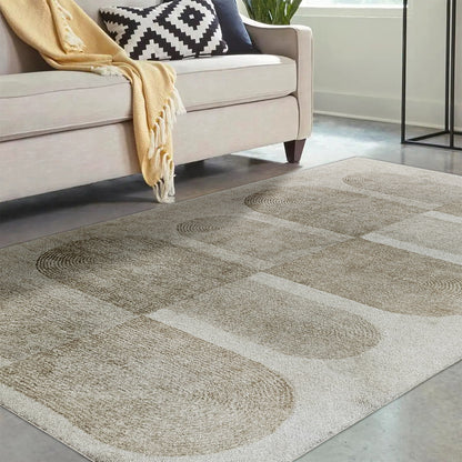 Tyche Soft Contemporary Printed Floor Rug 160 x 230cm showcased on a floor, highlighting its plush texture and intricate pattern. The surrounding furniture includes a couch with a black and white pillow and yellow blanket.