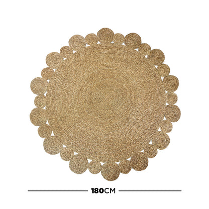 Una 180cm Seagrass Rug - Brown: A large, round woven rug with a concentric spiral pattern and coiled bubble motifs, crafted from natural fibers, measuring 180 cm in diameter.