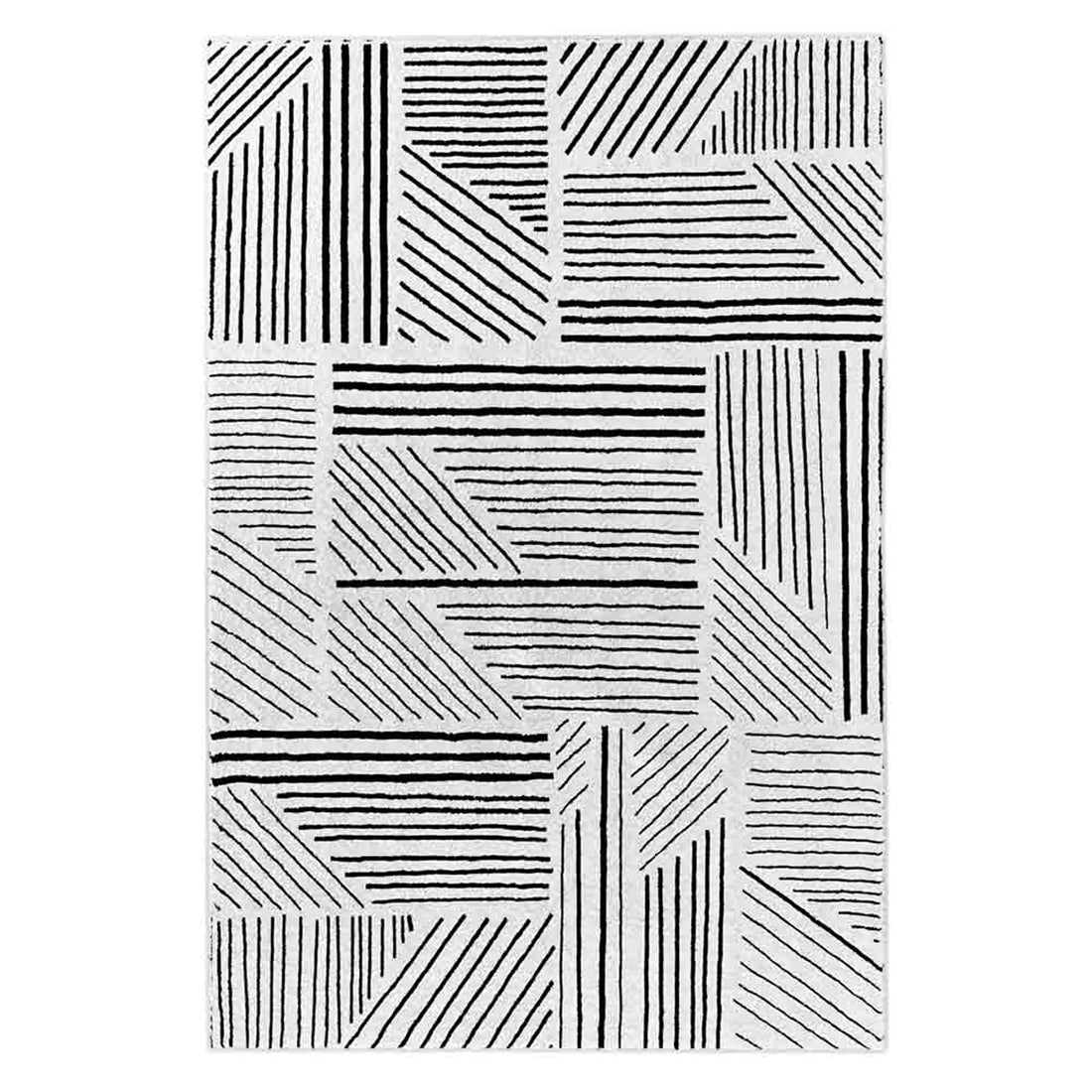 Vikki 120x170cm Small Abstract Contemporary Floor Rug features a black-and-white geometric grid of rectangular and triangular blocks with parallel lines, creating a modern patchwork pattern.
