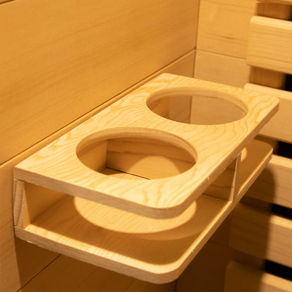 Harlow 2 Person Canadian Hemlock Infrared Home Sauna shows a light wood double cup holder rack, mounted in a wooden sauna interior, highlighting its functional and stylish design.
