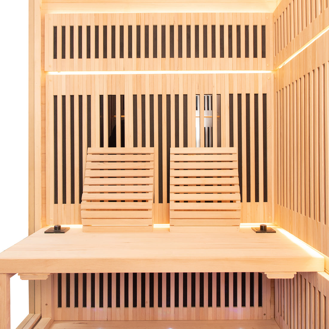 Interior of the Hoito 4-Person Full Spectrum Infrared Sauna with Glass Floor Heaters, showing light wood paneling, slatted backrests, LED lighting, and control modules on the bench ends.