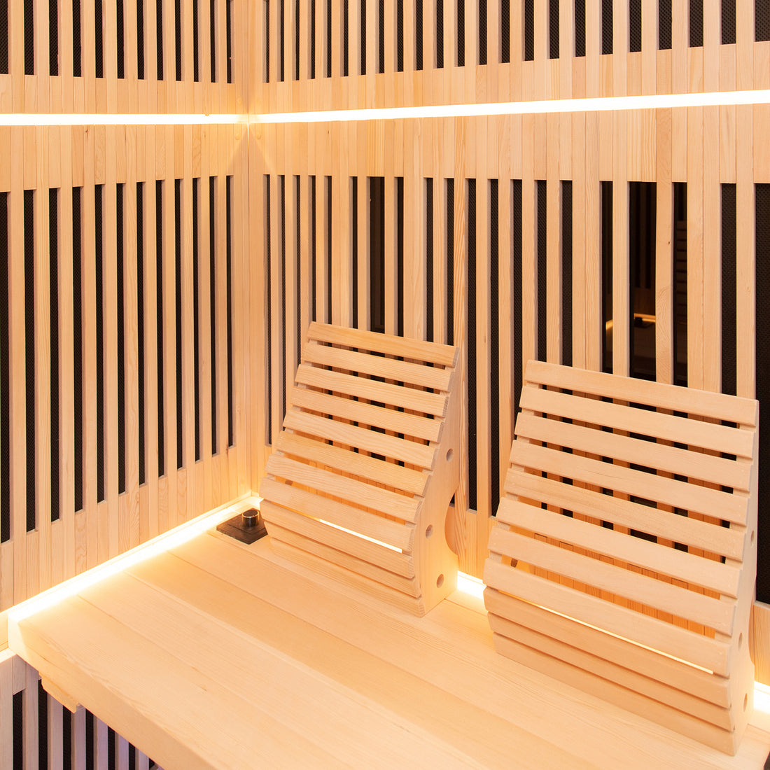 Hoito 4-Person Full Spectrum Infrared Sauna features light-wood slatted walls, benches, adjustable backrests, and soft accent lighting, offering a modern, inviting spa experience with glass floor heaters.