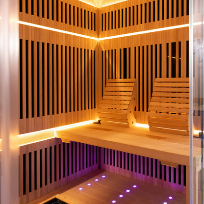 Hoito 4-Person Full Spectrum Infrared Sauna with Floor Heaters showcased with slatted wood paneling, ergonomic backrests, recessed LED lighting, and glass floor heater for an immersive spa experience.