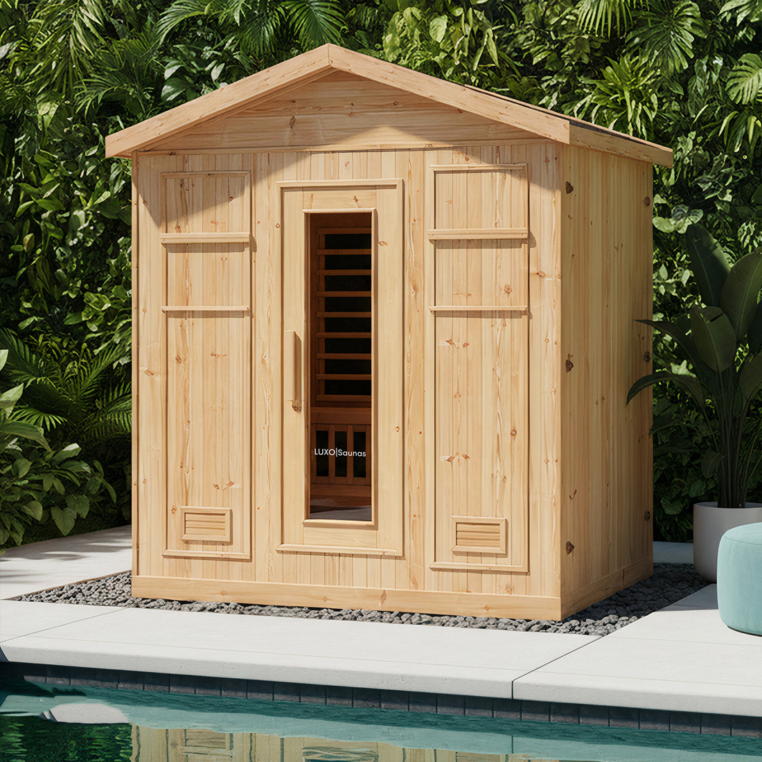 Kiima 6 Person Hybrid Finnish Outdoor Sauna in Natural on a patio, features a glass door with LUXO Saunas logo, wooden-slatted interior, and tropical backdrop, enhancing backyard relaxation.