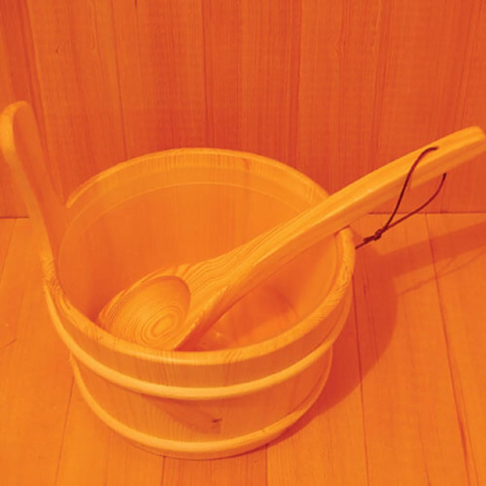 Kivi 3-Person Traditional Stove Finnish Indoor Home Sauna features a small wooden pail with a ladle for pouring water over hot stones, enhancing the authentic sauna experience.