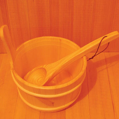 Kivi 3-Person Traditional Stove Finnish Indoor Home Sauna features a small wooden pail with a ladle for pouring water over hot stones, enhancing the authentic sauna experience.
