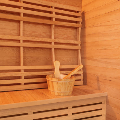 Kivi 4-Person Traditional Finnish Outdoor Sauna featuring a wooden bucket and spoons inside, highlighting its spacious interior and authentic wooden features, ideal for a luxurious backyard sauna experience.