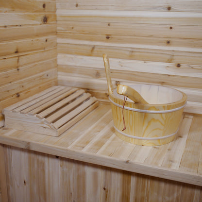 Kivi 4-Person Traditional Outdoor Finnish Home Sauna featuring light timber paneling, wooden bench with slatted headrest, and a wooden bucket with ladle, exemplifying elegant craftsmanship for a personal spa retreat.